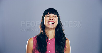 Buy stock photo Humor, woman and happy for laugh in studio with confidence, joke and good mood on gray background. Space, excited model and smile with fun personality for comedy, joy or funny reaction to meme