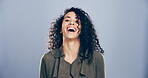 Woman, portrait and laughing for success in studio, joy for opportunity in creative career or promotion. Happy, space and female person excited with comic illustrator or designer on blue background