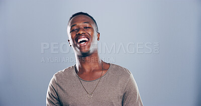 Buy stock photo Face, black man and happy for laugh in studio with confidence, joke and good mood on gray background. Space, model and smile with personality portrait for comedy, humor or funny reaction to meme