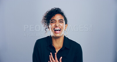 Buy stock photo Portrait, woman and happy for laugh in studio with confidence, joke and good mood on gray background. Space, young model and smile with fun personality for comedy, humor or funny reaction to meme