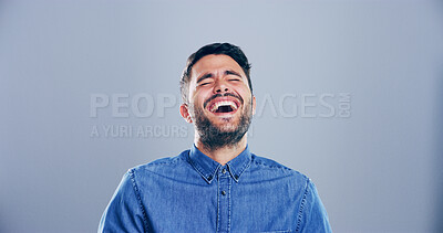 Buy stock photo Crazy, man and happy for laughing in studio with confidence, joke or good mood on gray background. Space, excited model and smile with fun personality for comedy, humor or funny reaction to meme