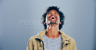 Buy stock photo Crazy, African man and happy for laugh in studio with confidence, joke and good mood on gray background. Space, model and smile with carefree personality for comedy, humor or funny reaction to meme