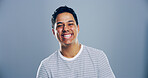 Happy man, portrait and laughing for success in studio, joy for opportunity in creative career or promotion. Space, person and excited for goals as comic illustrator or designer on blue background