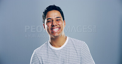 Buy stock photo Happy man, portrait and laughing for success in studio, joy for opportunity in creative career or promotion. Space, person and excited for goals as comic illustrator or designer on blue background