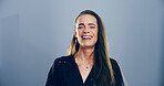 Portrait, woman and laughing in studio for joke, funny comedy and smile isolated on gray background with space. Face, lol and female person with humor, excited and happy with comic emotion in USA