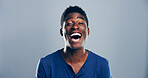 Crazy, African man and smile for laugh in studio with confidence, joke or good mood on gray background. Space, model and happy with carefree personality for comedy, humor or funny reaction to meme