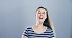 Portrait, woman and laughing in studio for funny joke, comedy and goofy isolated on gray background with space. Face, lol and female person with humor, excited and happy with comic emotion in USA
