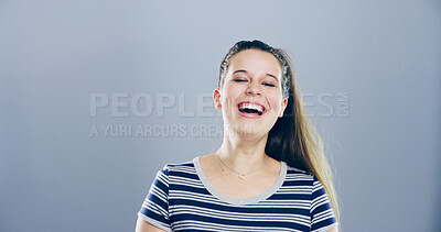 Buy stock photo Portrait, woman and laughing in studio for funny joke, comedy and goofy isolated on gray background with space. Face, LOL and female person with humor, excited and happy with comic emotion in USA