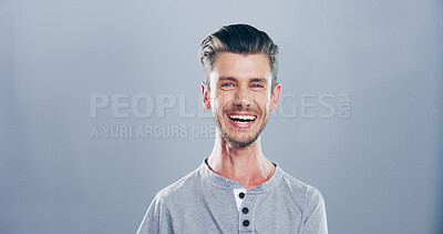 Buy stock photo Happy, laugh and portrait of man in studio for funny joke, humor and comedy on gray background. Mockup space, isolated person with smile for positivity, cheerful and joy for positive emotion