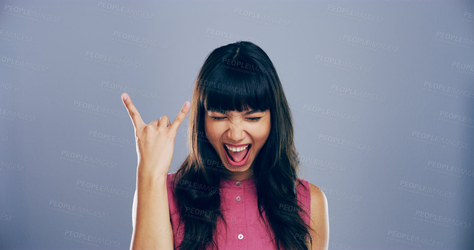 Buy stock photo Space, screaming and girl with rock hand gesture in studio for expression or mockup on gray background. Culture, edgy female rocker and crazy woman with devil horn sign, funky emoji and punk symbol
