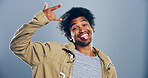Space, cool or portrait of happy man with rock hand gesture in studio for wild expression on gray background. Culture, edgy rocker and crazy person with devil horn sign, funky emoji and punk symbol
