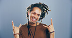 Space, dreadlocks or portrait of man with rock hand gesture in studio for expression on grey background. Jamaica, edgy rocker and crazy person with devil horn sign, funky emoji and cool punk symbol