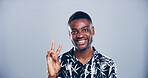 Portrait, confidence and black man with peace sign in studio with positive attitude, mockup space or facial expression. Grey background, face or African male model for cool gesture, fashion or symbol