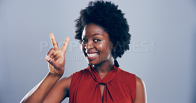 Buy stock photo Portrait, peace sign and black woman in studio, symbol and confidence on blue background. Face, African person and model with hand gesture, support and emoji with kindness, good vibes and space
