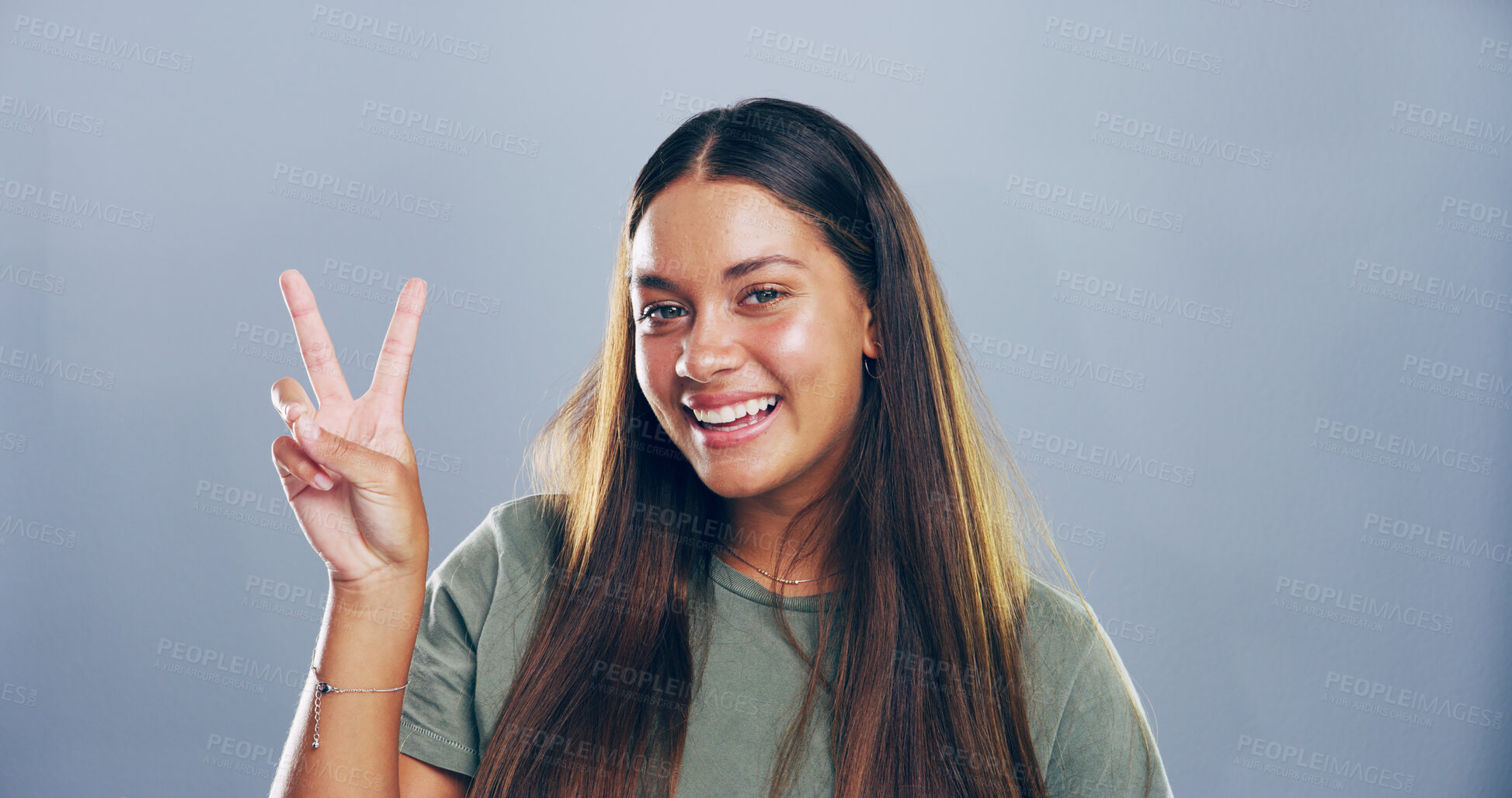 Buy stock photo Portrait, peace sign and woman in studio, joy and confidence on gray background. Face, person and model with hand gesture, support and agreement with symbol, good vibes and emoji with icon or smile