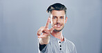 Portrait, space and happy man with peace sign, confidence or positive attitude for expression. Grey background, casual student and proud male model in studio for cool gesture, fashion or v symbol