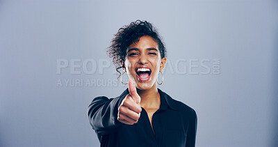 Buy stock photo Portrait, thumbs up and woman in studio, excited and agreement on gray background. Face, person and model with hand gesture, support and feedback with symbol, perfect and like with emoji and review
