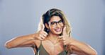 Girl, portrait and happy with thumbs up in studio for win approval, vote agreement and support. Mockup, person and positive feedback with like gesture for review praise or opinion on gray background