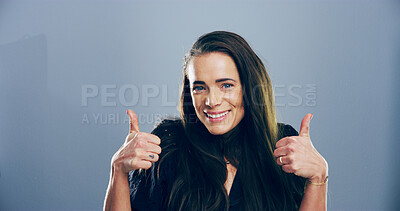 Buy stock photo Portrait, thumbs up and woman in studio, thank you and confidence on gray background. Face, person and model with hand gesture, agreement and icon with symbol, promote and like with emoji and review
