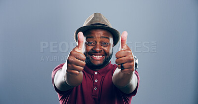 Buy stock photo Happy, black man or portrait with thumbs up for approval, success or good job on a gray studio background. Face, male person or model with smile, like emoji or yes sign for winning on mockup space