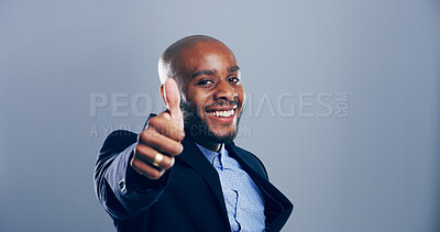 Buy stock photo Happy, black man and portrait with thumbs up for business success or approval on a gray studio background. Face, businessman or model with smile, like emoji or yes sign for winning on mockup space