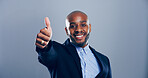 Happy, businessman and portrait with thumbs up for approval or good job on a gray studio background. Face, black man or model in joy with smile, like emoji or yes sign for winning on mockup space