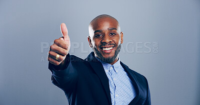 Buy stock photo Happy, businessman and portrait with thumbs up for approval or good job on a gray studio background. Face, black man or model in joy with smile, like emoji or yes sign for winning on mockup space