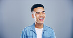 Man, happy and wink in studio portrait, confident and flirt with emoji, space and eye symbol by background. Person, model and smile with sign, icon and laugh with secret, deal or joke in Colombia