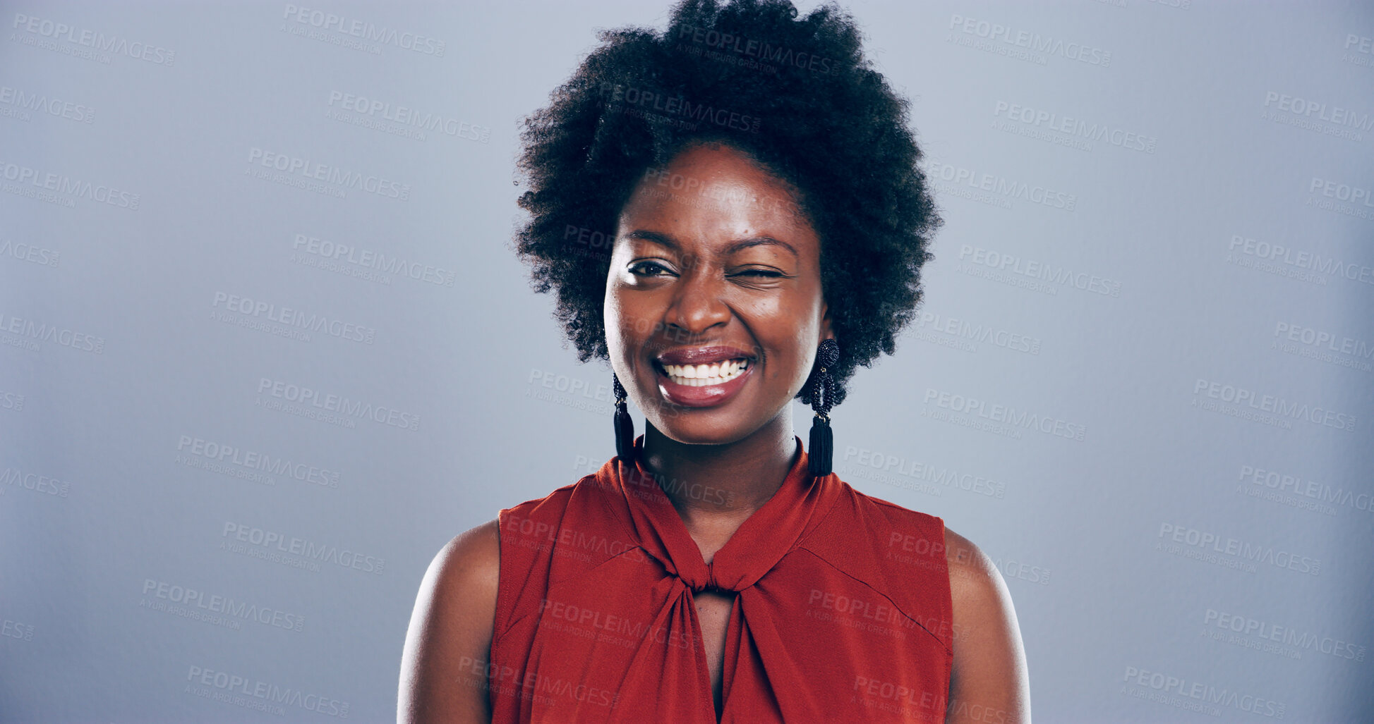 Buy stock photo Black woman, happy and face with wink in studio portrait, sign or emoji for secret, flirt or joke by background. Person, model and smile with icon, style and eye symbol by space with pride in Nigeria