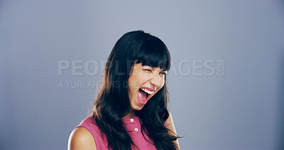 Buy stock photo Woman, excited and face with wink in studio portrait, sign or emoji with secret, flirt and laugh by background. Person, model and smile with icon, win or eye symbol by space with confidence in Italy