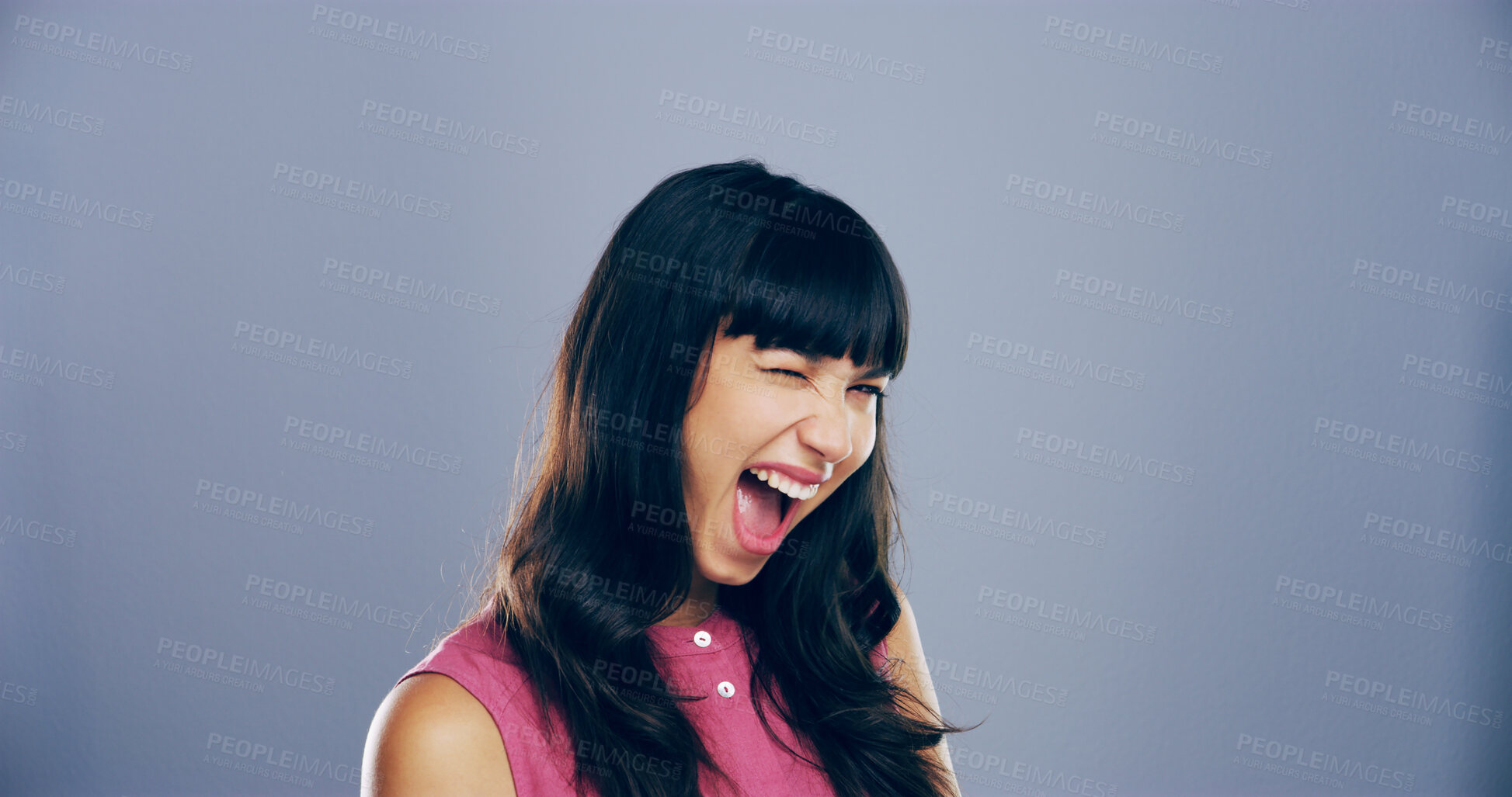 Buy stock photo Woman, excited and face with wink in studio portrait, sign or emoji with secret, flirt and laugh by background. Person, model and smile with icon, win or eye symbol by space with confidence in Italy