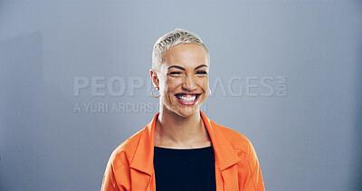 Buy stock photo Woman, wink and playful in studio portrait, emoji and flirting with eye symbol by background. Person, model and happy with icon, space and secret with trendy fashion, deal and laughing in Mexico