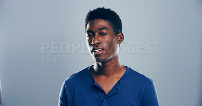 Buy stock photo Black man, smile and wink in studio portrait, sign or emoji with secret for flirting by background. Person, model and happy with face, style and expression for confidence by space with pride in Kenya