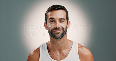 Buy stock photo Skincare, face cream and portrait of man in studio for wellness, health and hydration for facial treatment. Dermatology, beauty and person with lotion, moisturizer or cosmetics on gradient background