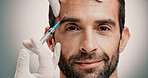 Portrait, man and injection for skincare in studio of facelift, cosmetic and antiaging treatment. Person, needle and beauty procedure for dermal filler, facial implants and change on white background
