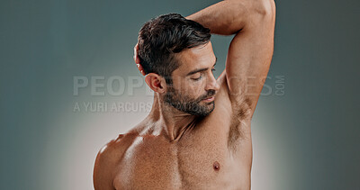 Buy stock photo Smelling, armpit and skincare for man, studio and wellness for skin with cosmetics, hygiene and space. Healthy, sniff and body care for underarm, confident and grooming in morning, muscles or person