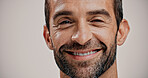Portrait, skincare and happy man with natural beauty, beard and facial treatment. Face, cosmetics and male model with confidence for dermatology, glow and aesthetic on white background with space