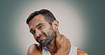 Buy stock photo Neck pain, stress and portrait of man in studio with injury, tension and inflammation on gradient background. Frustrated, health and person with massage for muscle strain, medical risk and pressure