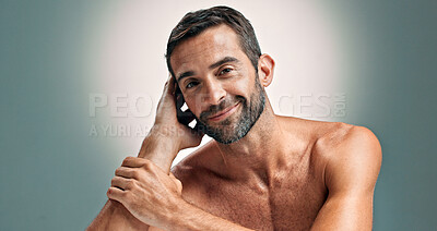 Buy stock photo Beauty, smile and skincare with portrait of man in studio for cleaning, salon grooming and dermatology. Self care, cosmetics and aesthetic with person on background for facial and spa treatment