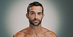Beauty, skincare and portrait of man in studio for natural, beard and facial treatment. Face, cosmetics and confident male model with dermatology, glow and aesthetic isolated on gray background
