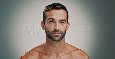 Buy stock photo Beauty, skincare and portrait of man in studio for natural, beard and facial treatment. Face, cosmetics and confident male model with dermatology, glow and aesthetic isolated on gray background