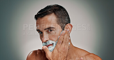 Buy stock photo Shaving, cream and beard with portrait of man in studio for grooming, beauty and cleaning. Hair removal, cosmetics and self care with person and foam on background for hygiene, skincare and salon