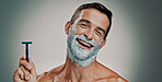 Shaving, cream and razor with portrait of man in studio for beard grooming, beauty and cleaning. Hair removal foam, cosmetics and self care with person on background for hygiene, skincare and salon