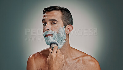 Buy stock photo Shaving, cream and brush with portrait of man in studio for beard grooming, beauty and cleaning. Hair removal, cosmetics and self care with person and foam on background for hygiene and skincare