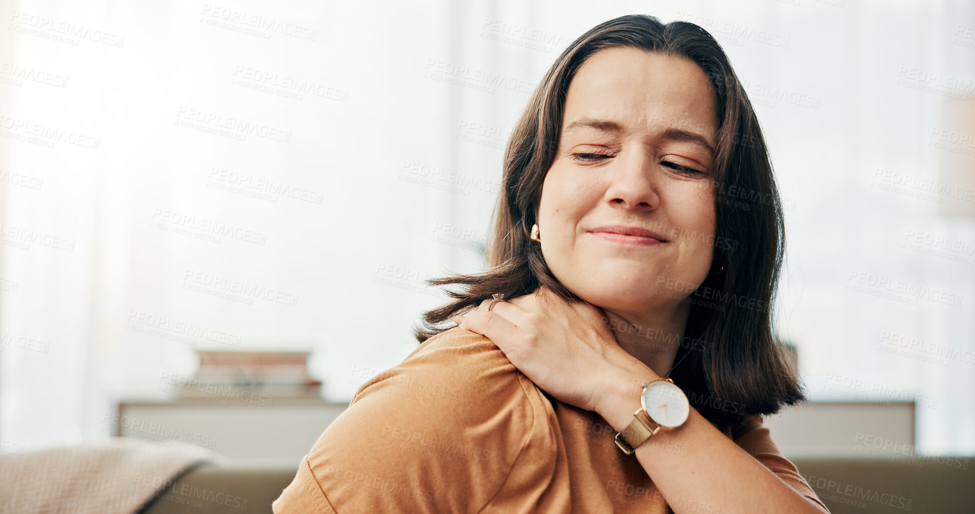 Buy stock photo Shoulder pain, injury and woman on sofa in home with stress, muscle tension and joint ache in living room. Health, burnout and tired person with medical crisis, inflammation and fatigue in house