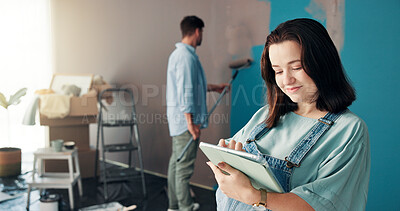 Buy stock photo Couple, painting and woman in home on tablet for interior design, planning and renovation in family nursery. Pregnancy, marriage and people on digital tech for decoration, remodeling and DIY project