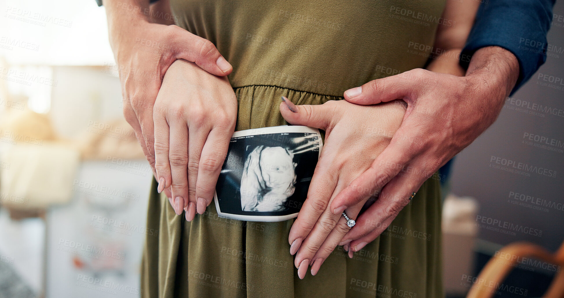 Buy stock photo Sonogram, pregnancy and hands of couple in home for family, prenatal care and maternity wellness. Love, support or husband with pregnant woman holding belly for baby ultrasound for growth development