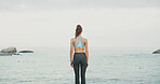 Back view, water and woman at sea for fitness, body health or thinking of wellness. Ocean, beach and calm person outdoor for exercise, planning training and peace on workout break with mockup space