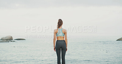 Buy stock photo Back view, water and woman at sea for fitness, body health or thinking of wellness. Ocean, beach and calm person outdoor for exercise, planning training and peace on workout break with horizon space