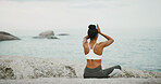 Ocean, calm and meditation for woman, outdoor and spiritual practice for wellness, peace and relax. Sea, chakra and self awareness with person, mindfulness and yoga with cognitive benefits and zen